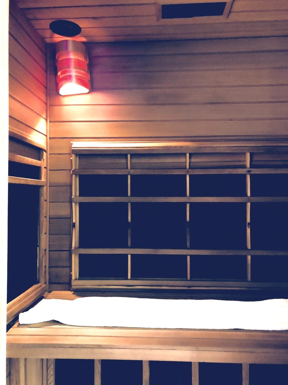 Warm wooden interior of the private infrared sauna