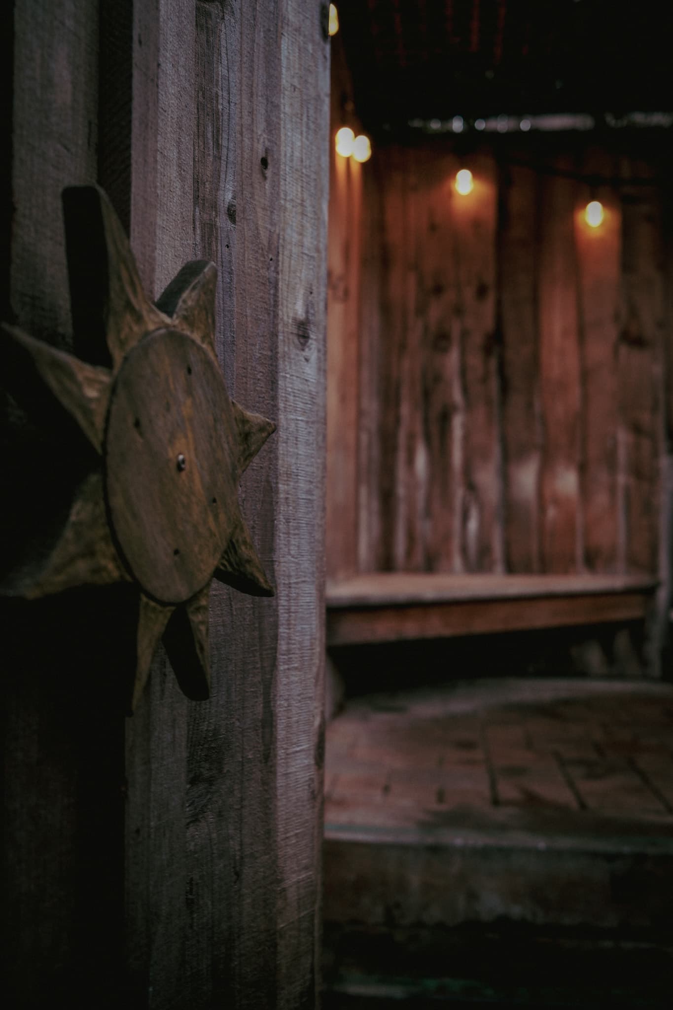 A handmade wooden sun marking the Sun Tub