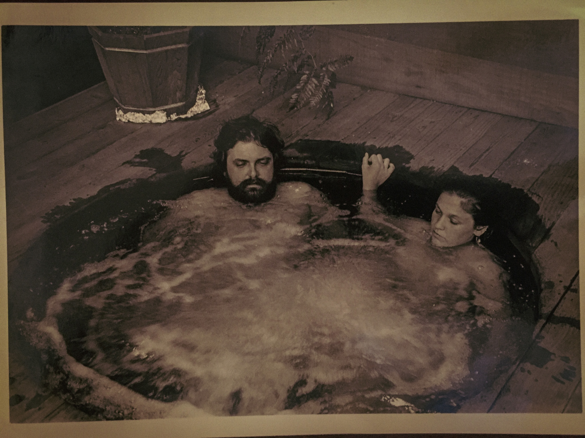 Historical photograph of two guests soaking in an early Almonte Spa tub